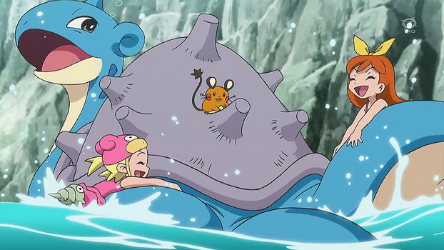 Visitors having fun swimming with Lapras