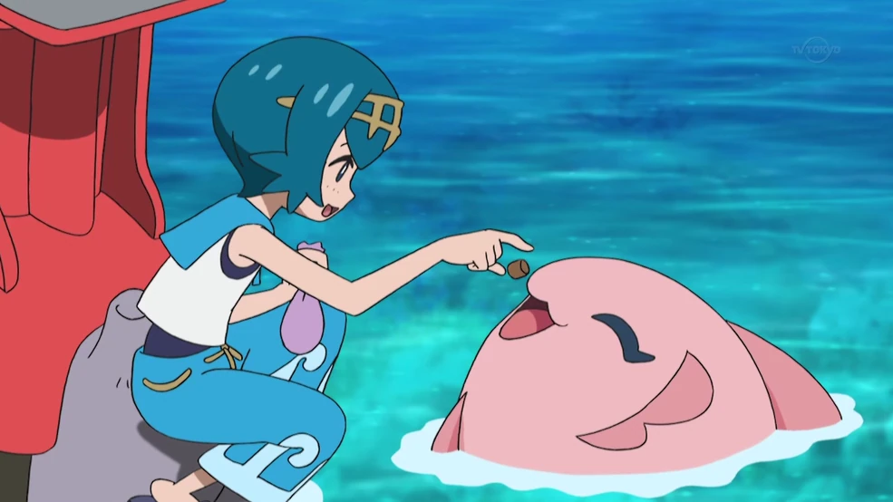 Trainer Lana feeding a Pokémon