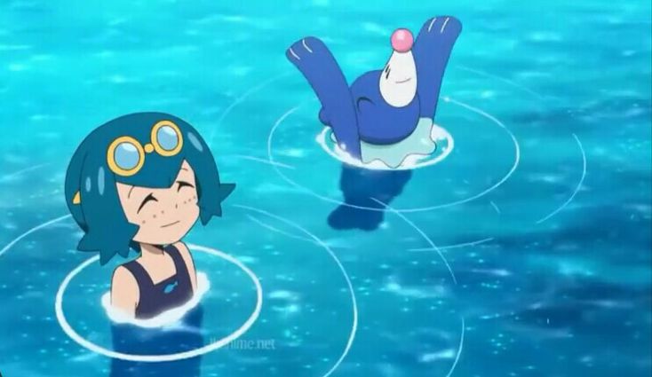 Trainer Lana swimming and smiling