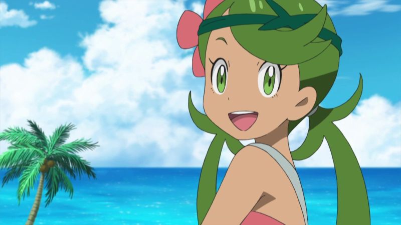 Trainer Mallow smiling with the sea behind her